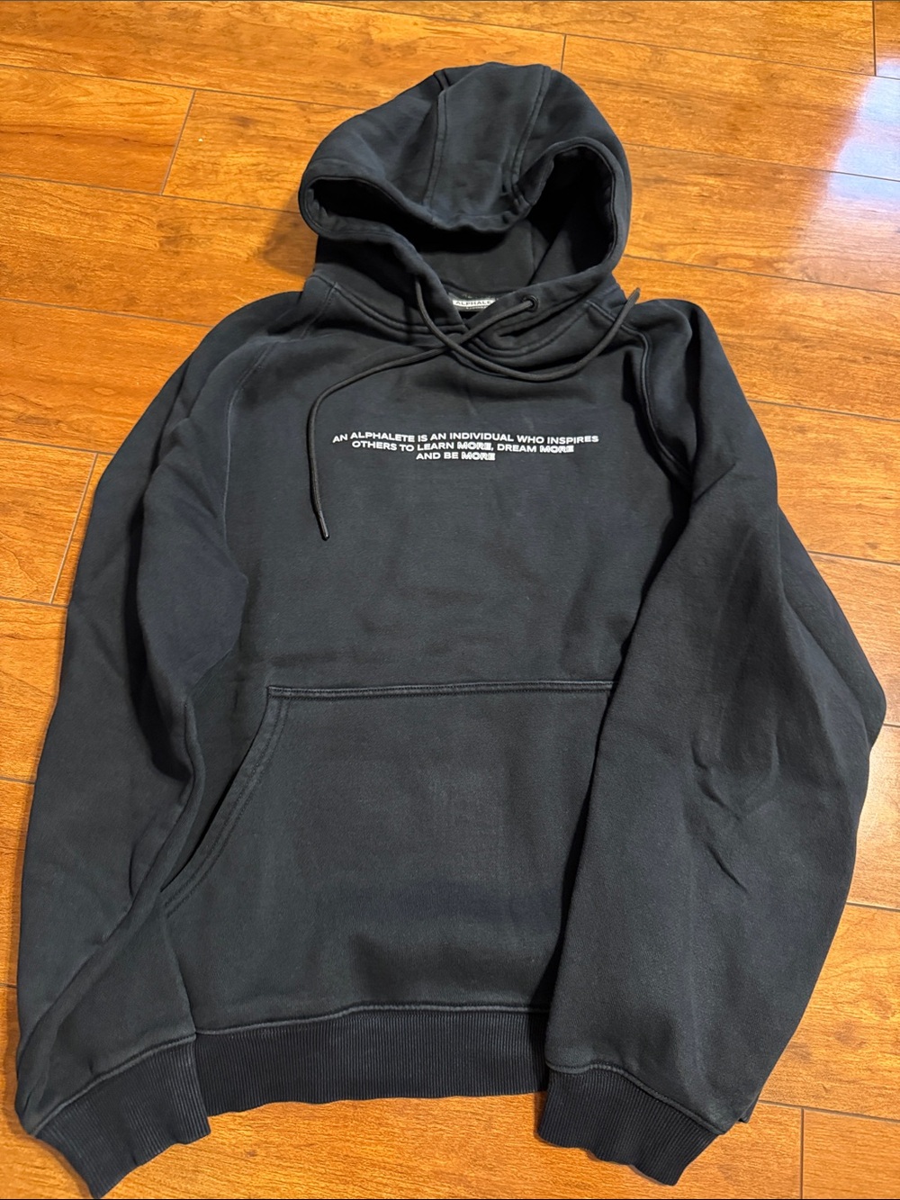 Alphalete Black Pullover Hoodie with White Chest Text